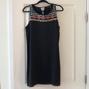 Sleek Black Dress with Tribal-y Stitchwork